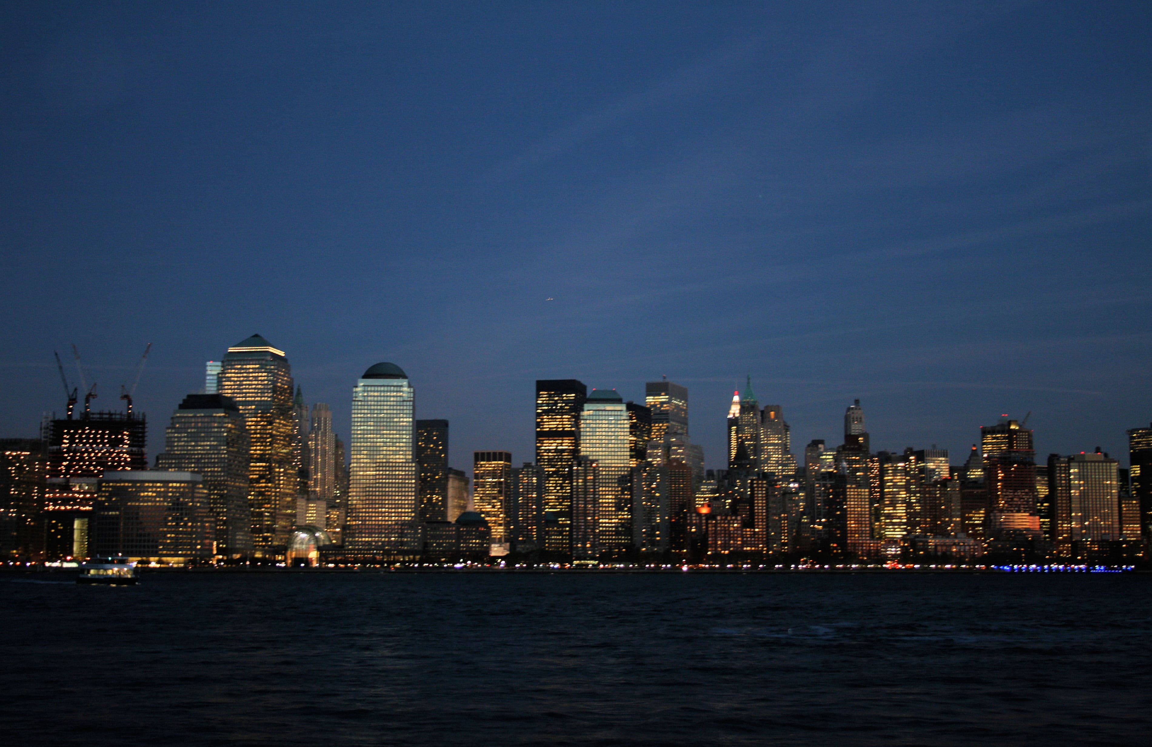 Manhattan skyline across the water at dusk